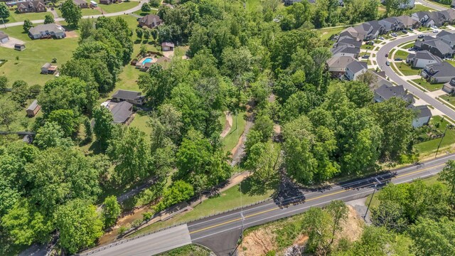 213 Hickory Trl, White House, TN 37188 - aerial view of property and surrounding area with nearby suburban area and a tree filled landscape