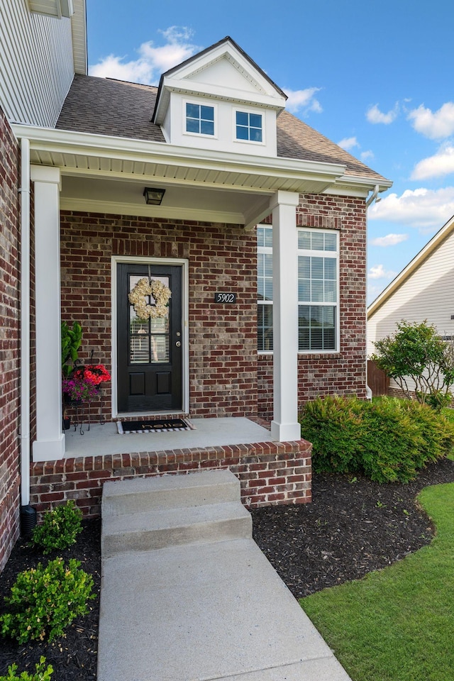 5902 Covent Ln, Smyrna, TN 37167 - entrance to property featuring a porch, brick siding, and a shingled roof