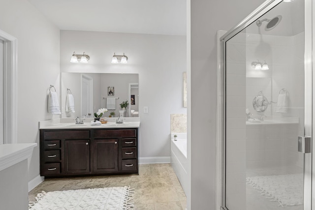 5902 Covent Ln, Smyrna, TN 37167 - full bath featuring a bath, double vanity, a shower stall, and baseboards
