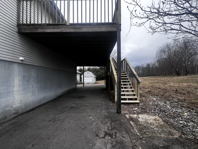 555 Oakley Allons Rd, Allons, TN 38541 - view of home's exterior featuring stairs, an outdoor structure, and an attached carport