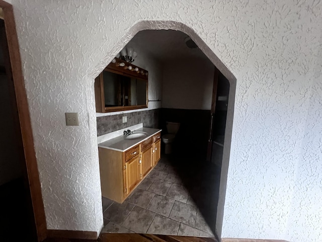 555 Oakley Allons Rd, Allons, TN 38541 - kitchen with dark tile patterned flooring, a textured wall, and a sink