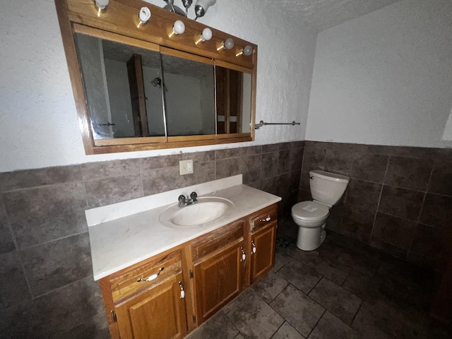 555 Oakley Allons Rd, Allons, TN 38541 - bathroom featuring tile walls, vanity, toilet, and a wainscoted wall