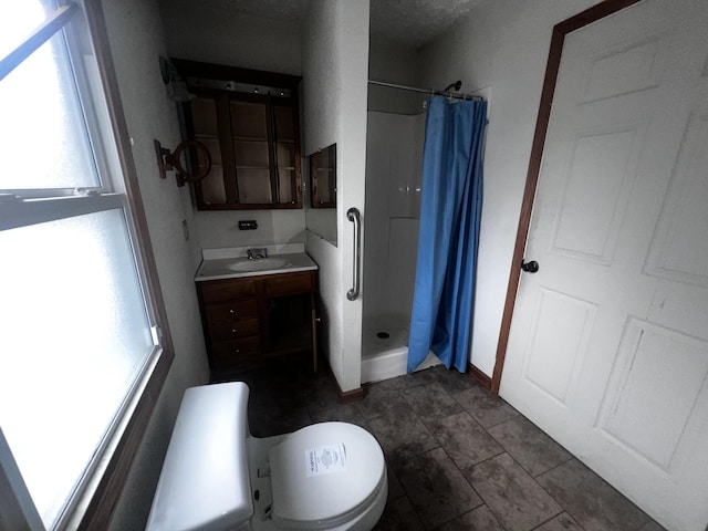 555 Oakley Allons Rd, Allons, TN 38541 - bathroom with a stall shower, vanity, and toilet
