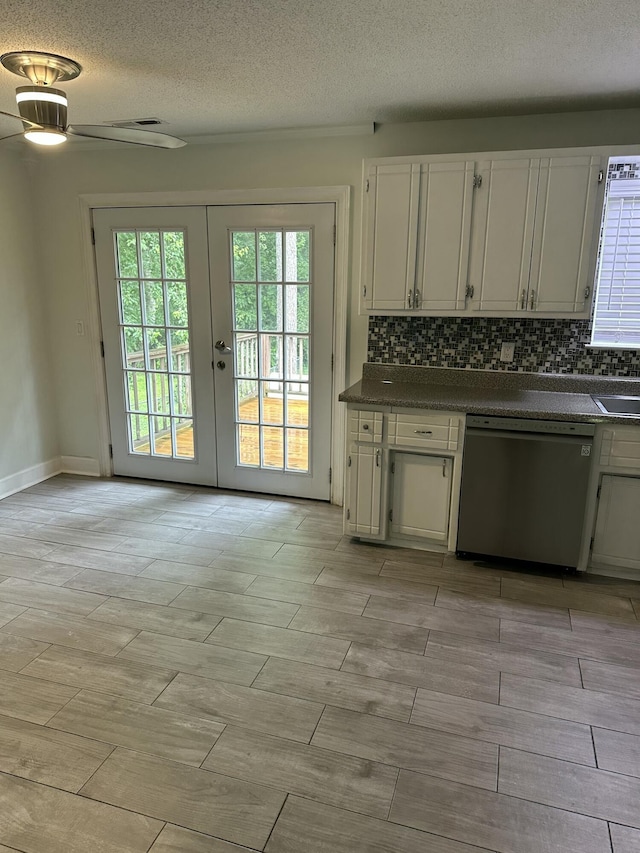 2514 Maplewood Dr, Chattanooga, TN 37421 - kitchen with dishwasher, dark countertops, french doors, tasteful backsplash, and white cabinets