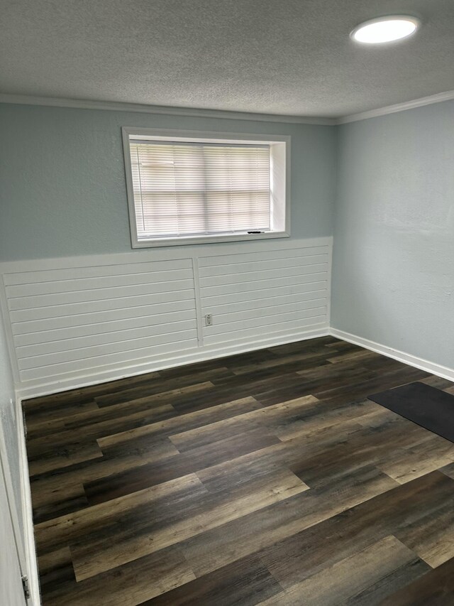 2514 Maplewood Dr, Chattanooga, TN 37421 - unfurnished room featuring ornamental molding, a textured ceiling, dark wood-style floors, and baseboards