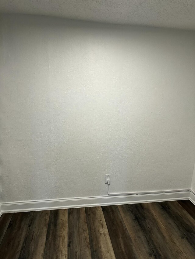 2514 Maplewood Dr, Chattanooga, TN 37421 - empty room featuring baseboards and dark wood-style floors