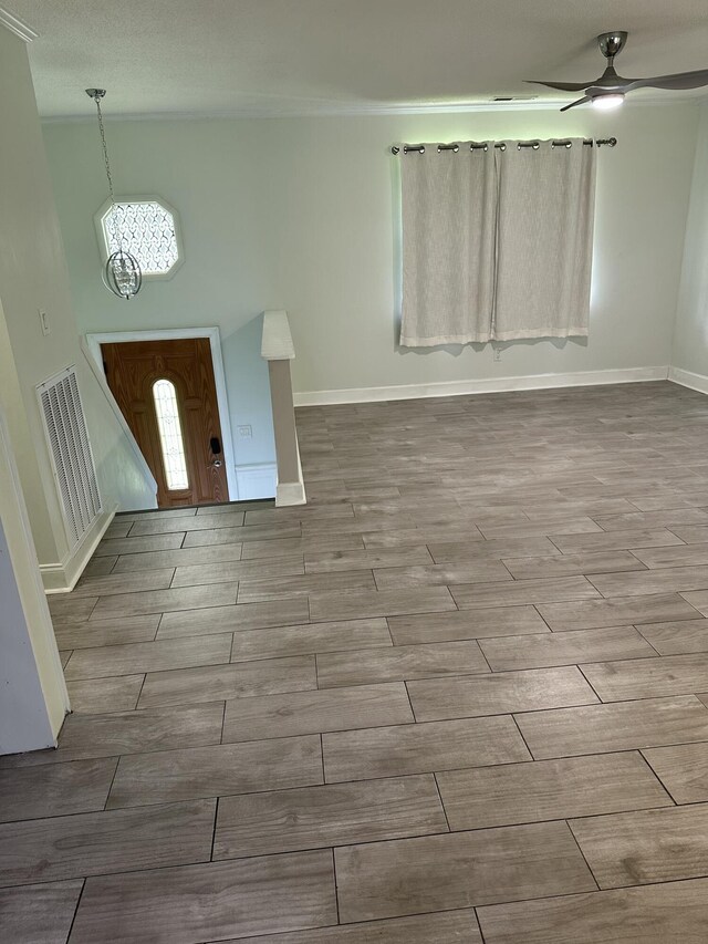 2514 Maplewood Dr, Chattanooga, TN 37421 - entryway featuring a chandelier, wood finished floors, a ceiling fan, and baseboards