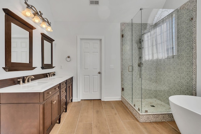 3033 Tybee Trl, Murfreesboro, TN 37127 - full bath featuring a shower stall, wood finished floors, and a freestanding bath