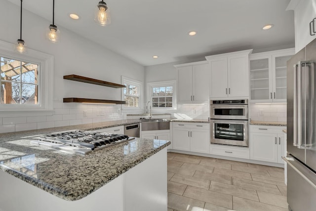 3033 Tybee Trl, Murfreesboro, TN 37127 - kitchen with stainless steel appliances, a sink, backsplash, open shelves, and white cabinets