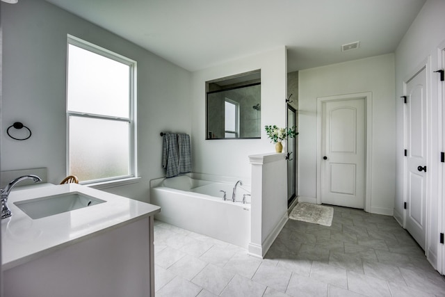 6510 Rusty Blackbird Ct, Murfreesboro, TN 37128 - bathroom featuring a shower stall, a bath, vanity, and baseboards