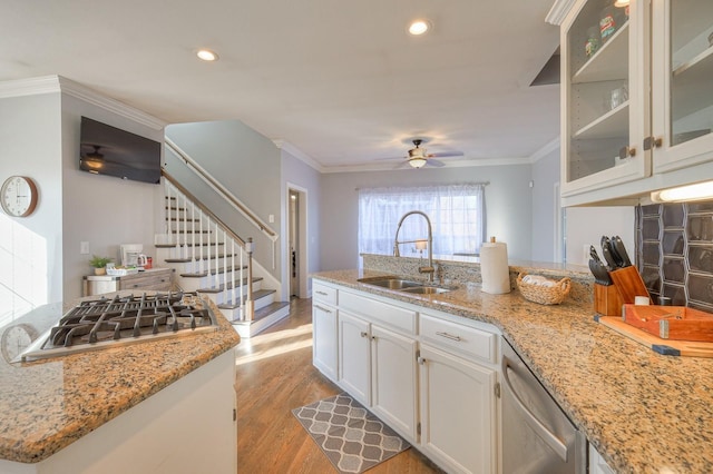 5784 Rock Springs Rd, Smyrna, TN 37167 - kitchen with a sink, stainless steel appliances, ceiling fan, a peninsula, and light wood-style floors