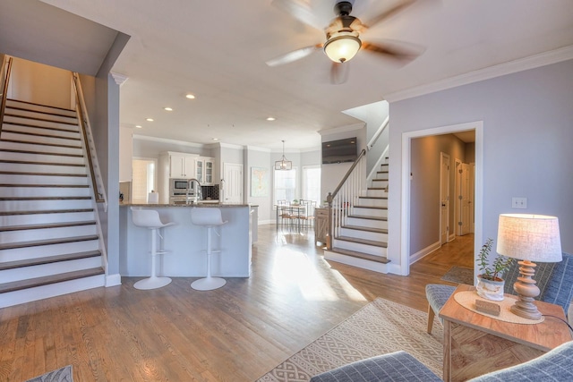 5784 Rock Springs Rd, Smyrna, TN 37167 - living room featuring stairway, ornamental molding, baseboards, wood finished floors, and ceiling fan