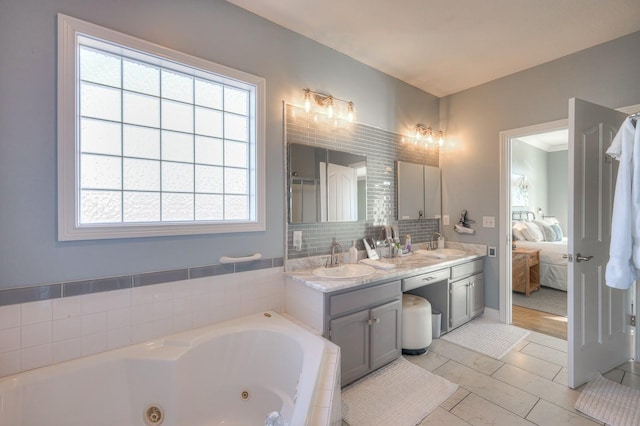 5784 Rock Springs Rd, Smyrna, TN 37167 - ensuite bathroom featuring a tub with jets, double vanity, and decorative backsplash