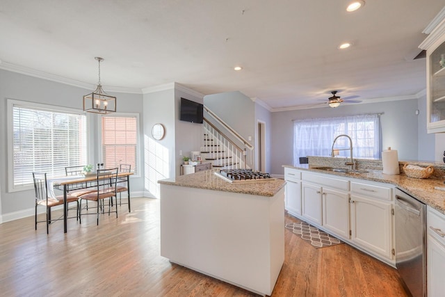 5784 Rock Springs Rd, Smyrna, TN 37167 - kitchen featuring appliances with stainless steel finishes, a sink, a ceiling fan, white cabinets, and a kitchen island