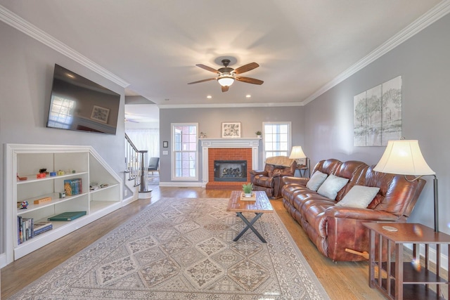 5784 Rock Springs Rd, Smyrna, TN 37167 - living area with ceiling fan, wood finished floors, crown molding, stairway, and a brick fireplace