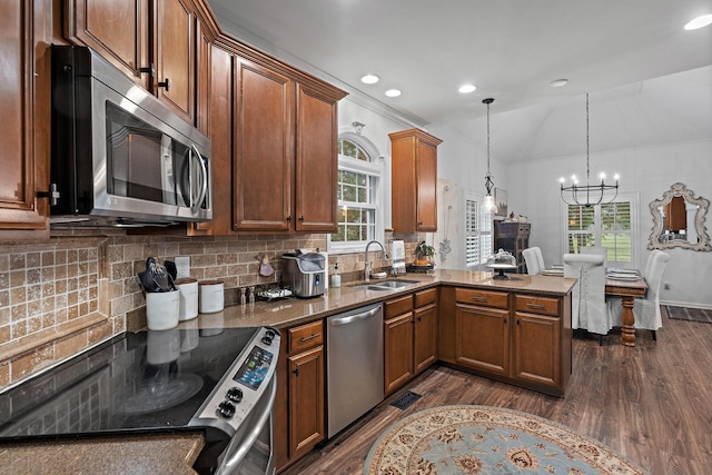 1013 Nealcrest Cir, Spring Hill, TN 37174 - kitchen with stainless steel appliances, a sink, dark wood-type flooring, a chandelier, and recessed lighting