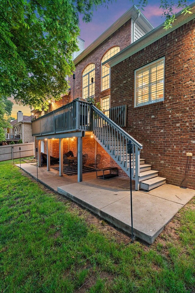 1013 Nealcrest Cir, Spring Hill, TN 37174 - rear view of house featuring a patio, a deck, brick siding, and stairway