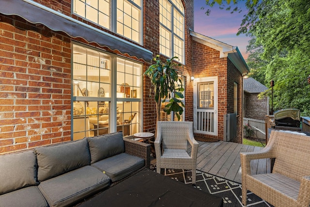 1013 Nealcrest Cir, Spring Hill, TN 37174 - deck at dusk featuring an outdoor hangout area