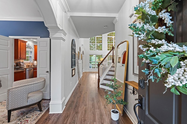 1013 Nealcrest Cir, Spring Hill, TN 37174 - entrance foyer featuring dark wood-style floors, decorative columns, stairs, baseboards, and ornamental molding
