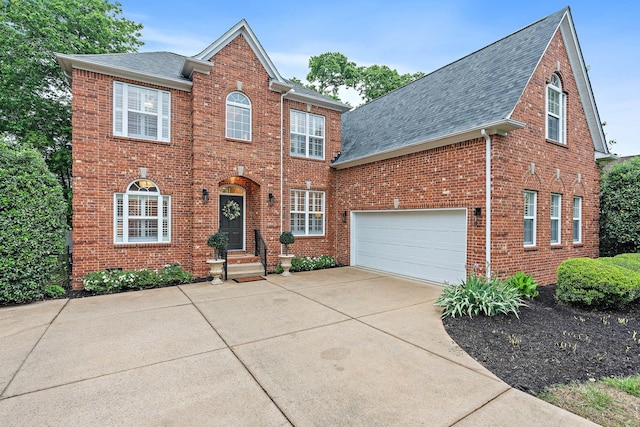 1013 Nealcrest Cir, Spring Hill, TN 37174 - view of front of home with roof with shingles, brick siding, and driveway