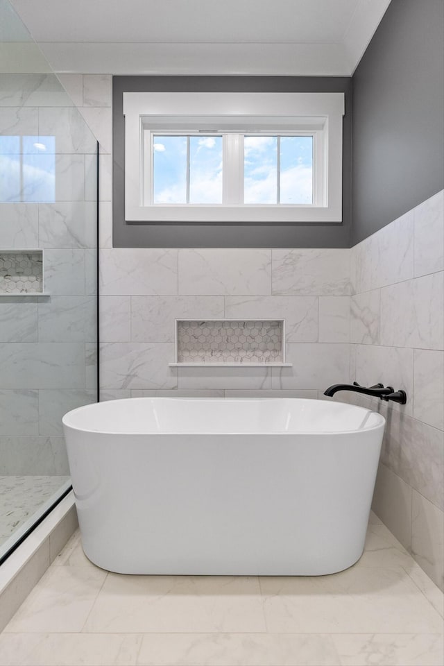 264 Goose Creek Cir, Soddy Daisy, TN 37379 - full bath with marble finish flooring, plenty of natural light, tile walls, a tile shower, and a freestanding tub