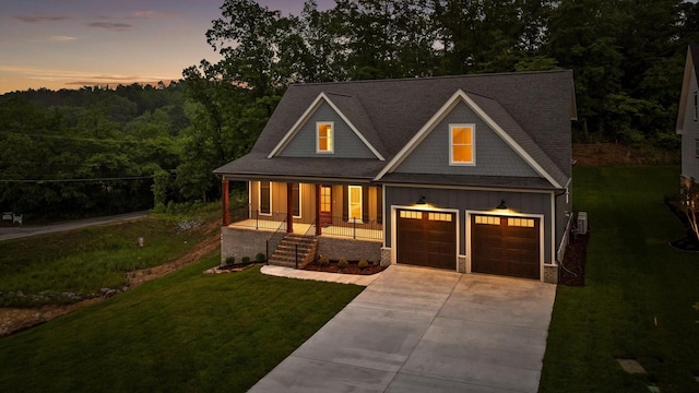 264 Goose Creek Cir, Soddy Daisy, TN 37379 - view of front of property with board and batten siding, covered porch, driveway, a front lawn, and a view of trees