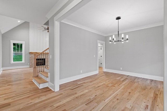 264 Goose Creek Cir, Soddy Daisy, TN 37379 - spare room featuring a chandelier, wood finished floors, stairs, baseboards, and crown molding