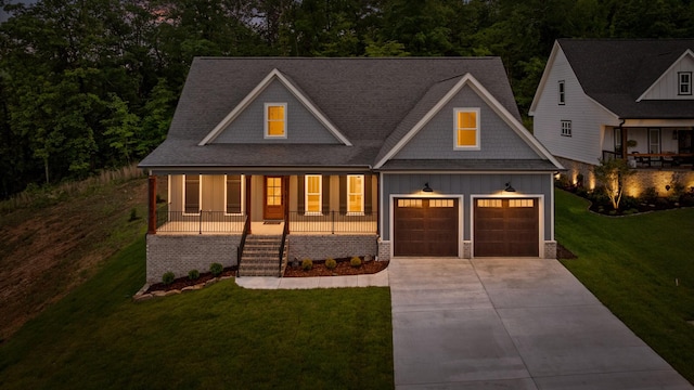 264 Goose Creek Cir, Soddy Daisy, TN 37379 - view of front of house featuring board and batten siding, a porch, concrete driveway, a front lawn, and stairs
