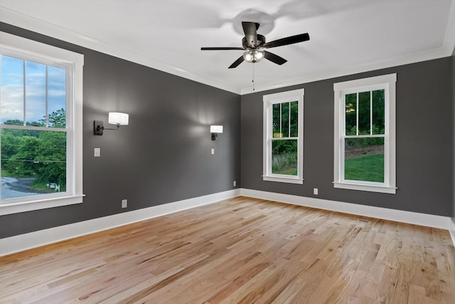 264 Goose Creek Cir, Soddy Daisy, TN 37379 - unfurnished room featuring light wood-style floors, a ceiling fan, baseboards, and crown molding