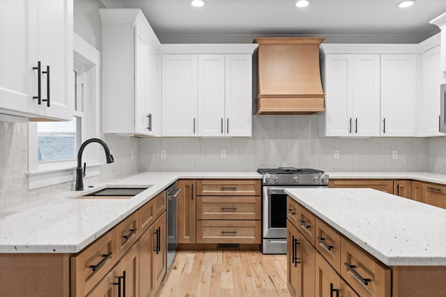 264 Goose Creek Cir, Soddy Daisy, TN 37379 - kitchen featuring appliances with stainless steel finishes, custom exhaust hood, a sink, white cabinetry, and recessed lighting