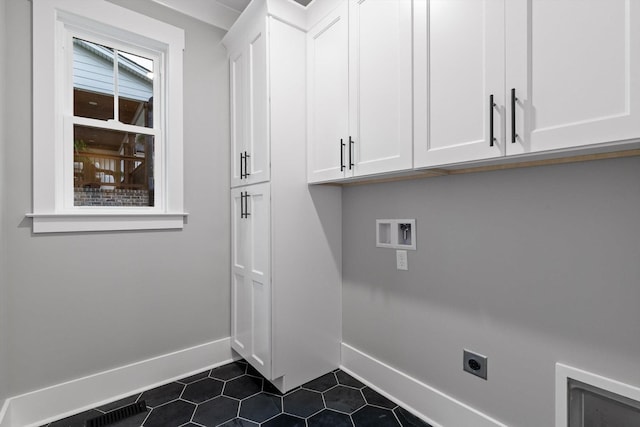 264 Goose Creek Cir, Soddy Daisy, TN 37379 - washroom with electric dryer hookup, baseboards, cabinet space, dark tile patterned flooring, and hookup for a washing machine