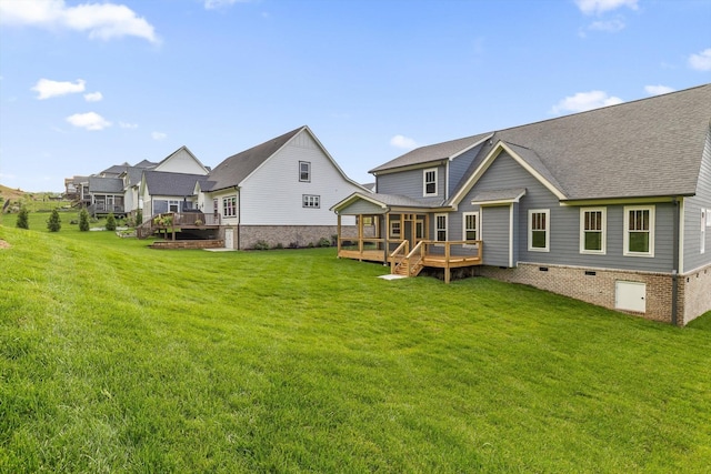 264 Goose Creek Cir, Soddy Daisy, TN 37379 - back of property with a wooden deck, a lawn, and roof with shingles
