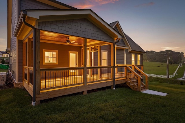 264 Goose Creek Cir, Soddy Daisy, TN 37379 - back of house at dusk with a yard and a wooden deck