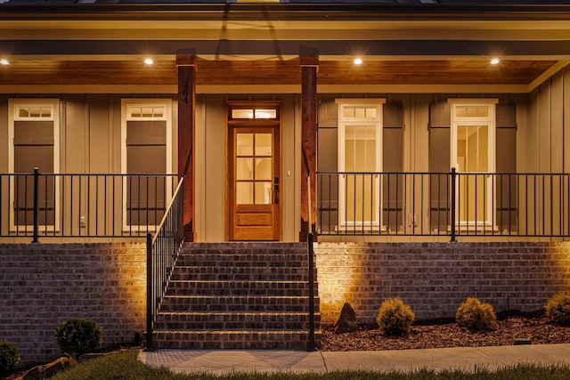 264 Goose Creek Cir, Soddy Daisy, TN 37379 - doorway to property featuring board and batten siding and covered porch