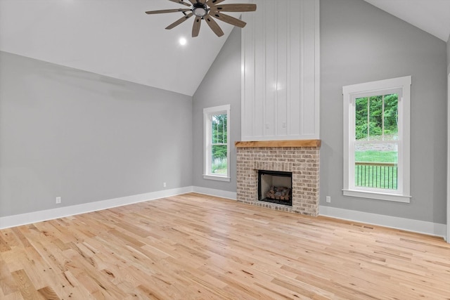 264 Goose Creek Cir, Soddy Daisy, TN 37379 - unfurnished living room featuring high vaulted ceiling, wood finished floors, ceiling fan, a fireplace, and baseboards