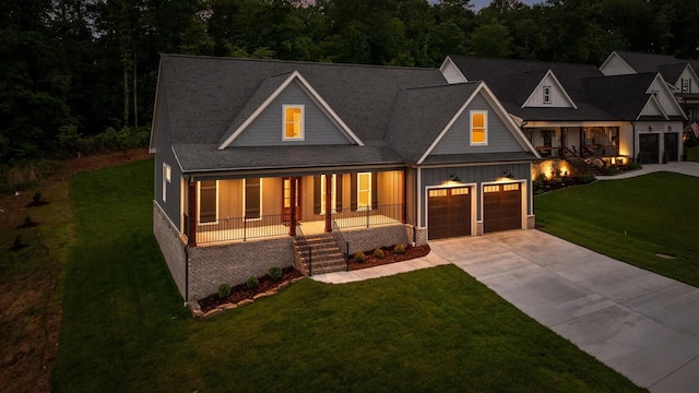 264 Goose Creek Cir, Soddy Daisy, TN 37379 - view of front of home with a porch, stairs, driveway, and a front yard