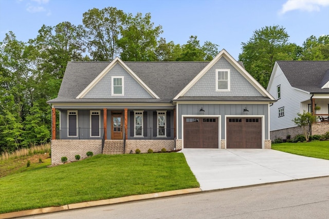 264 Goose Creek Cir, Soddy Daisy, TN 37379 - craftsman inspired home with board and batten siding, a porch, concrete driveway, a front yard, and brick siding