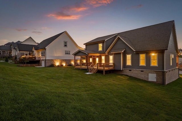 264 Goose Creek Cir, Soddy Daisy, TN 37379 - back of property at dusk with a lawn, crawl space, a wooden deck, and roof with shingles