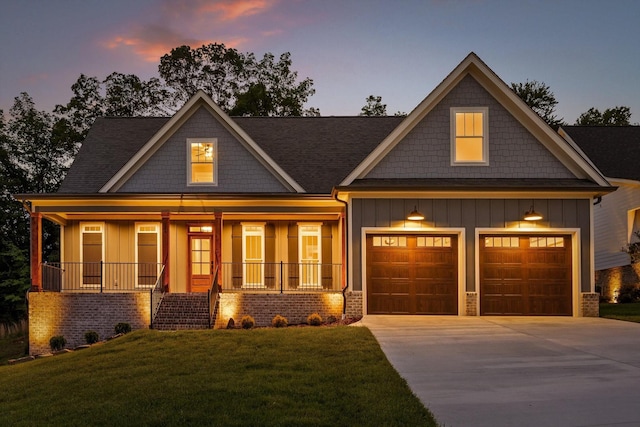 264 Goose Creek Cir, Soddy Daisy, TN 37379 - craftsman-style home with board and batten siding, a porch, concrete driveway, a front lawn, and a shingled roof