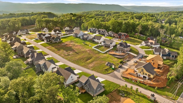 264 Goose Creek Cir, Soddy Daisy, TN 37379 - aerial view of property's location with a forest, nearby suburban area, and a mountainous background