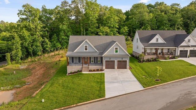 264 Goose Creek Cir, Soddy Daisy, TN 37379 - view of front facade featuring a porch, concrete driveway, and a front lawn