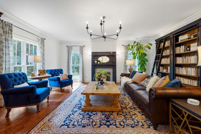 5432 Parker Branch Rd, Franklin, TN 37064 - living room featuring crown molding, wood finished floors, and a chandelier