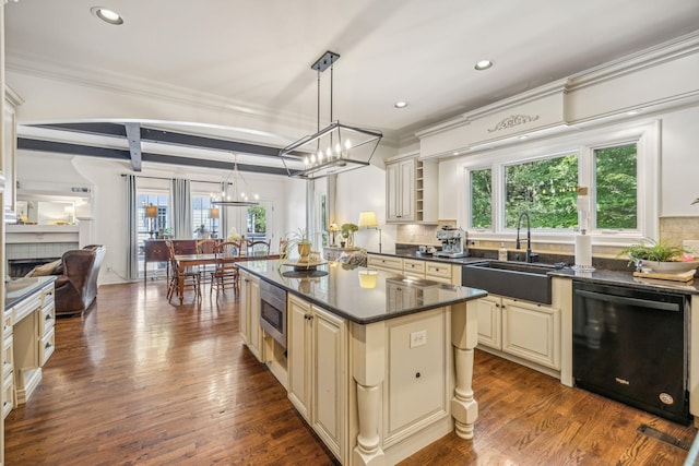5432 Parker Branch Rd, Franklin, TN 37064 - kitchen with black dishwasher, cream cabinets, a sink, a chandelier, and stainless steel microwave