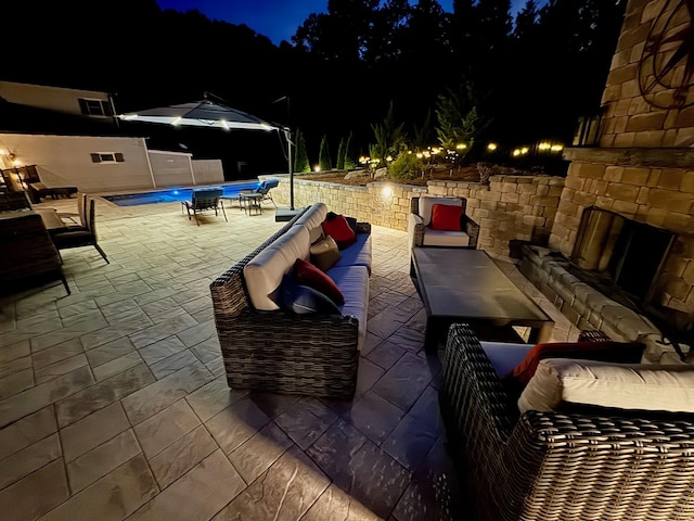 5432 Parker Branch Rd, Franklin, TN 37064 - patio at twilight with an outdoor living space with a fireplace