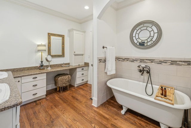 5432 Parker Branch Rd, Franklin, TN 37064 - full bathroom featuring vanity, crown molding, a soaking tub, tile walls, and wood finished floors