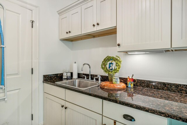 5432 Parker Branch Rd, Franklin, TN 37064 - kitchen featuring a sink, white cabinets, and dark stone countertops