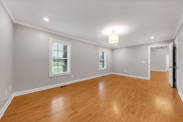 205 Jackson St, Cowan, TN 37318 - empty room featuring ornamental molding, plenty of natural light, recessed lighting, light wood-type flooring, and baseboards
