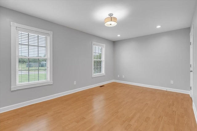 205 Jackson St, Cowan, TN 37318 - unfurnished room with light wood-style floors, baseboards, and recessed lighting