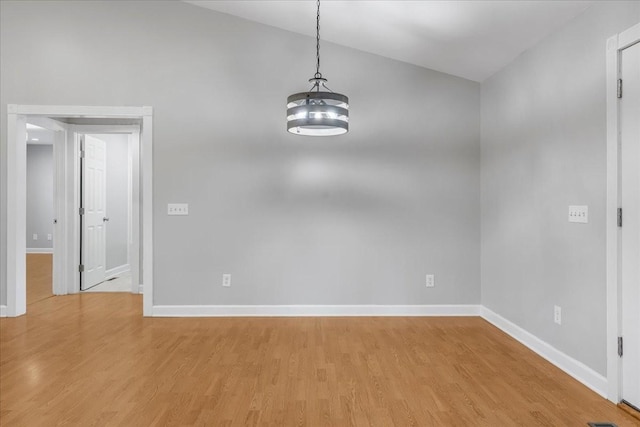 205 Jackson St, Cowan, TN 37318 - unfurnished room featuring light wood-type flooring, baseboards, and vaulted ceiling