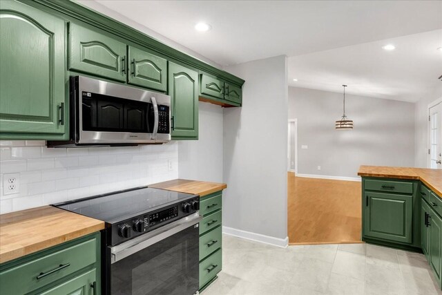 205 Jackson St, Cowan, TN 37318 - kitchen featuring range with electric stovetop, butcher block counters, stainless steel microwave, green cabinets, and recessed lighting